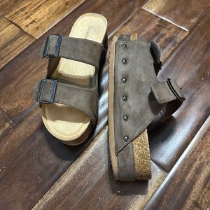 Platform sandals are a 5 but fit a 6 as well. They are new.